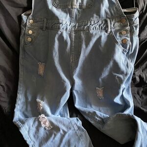 Women’s distressed bib jeans
